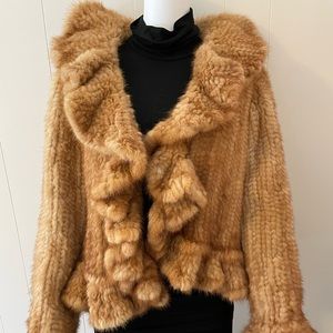 Caramel Mink Jacket. Ruffle detail along hemline, and large ruffle cuff. Sized M